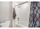 This bright bathroom has white subway tile in the shower/tub and modern fixtures at 7121 W Asbury Pl, Lakewood, CO 80227