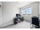 Bright home office with carpet, natural light, and ample desk space at 7121 W Asbury Pl, Lakewood, CO 80227