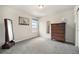 Bedroom with neutral paint and carpeting, closet, and a large window for plenty of natural light at 7121 W Asbury Pl, Lakewood, CO 80227