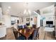 Spacious open-concept living area featuring a modern kitchen, dining space, and cozy living room at 7121 W Asbury Pl, Lakewood, CO 80227