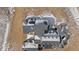 Overhead shot of a snow-dusted roof on a modern home surrounded by a large dirt lot at 28450 E 159Th Ave, Brighton, CO 80603