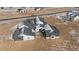 An aerial view showcases the expansive layout of the home, highlighting its multiple wings and varied rooflines at 28450 E 159Th Ave, Brighton, CO 80603