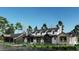 A picturesque two-story home featuring a covered porch, manicured landscaping, and a harmonious blend of materials at 28450 E 159Th Ave, Brighton, CO 80603