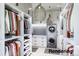 Walk-in laundry room with washer, dryer, and ample storage at 28450 E 159Th Ave, Brighton, CO 80603
