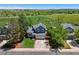 Two-story home with an attached garage, surrounded by mature trees and green space views at 8680 Apache Plume Dr, Parker, CO 80134