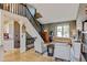 Inviting living room showcases hardwood floors, a modern staircase, and ample natural light at 8680 Apache Plume Dr, Parker, CO 80134