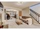 Comfortable living room featuring a gray sofa, a fireplace, and a home gym area with exercise equipment at 8680 Apache Plume Dr, Parker, CO 80134