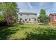 Large backyard with expansive lawn and outdoor living area, perfect for entertaining at 5434 S Rome St, Aurora, CO 80015