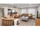 Finished basement area with plush seating, a convenient bar area, and plenty of room for relaxation and entertaining at 5434 S Rome St, Aurora, CO 80015