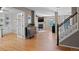 Open-concept living space features hardwood floors, a fireplace, and seamless flow to the kitchen and other living areas at 5434 S Rome St, Aurora, CO 80015