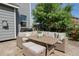 Outdoor patio area with wicker seating and coffee table, perfect for relaxing or entertaining at 5434 S Rome St, Aurora, CO 80015