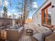 Outdoor deck with comfortable seating, a fire pit, and access to a well-maintained yard at 6795 W 29Th Ave, Wheat Ridge, CO 80214