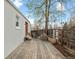 Wooden deck with comfortable seating, outdoor fire pit, and fenced yard at 6795 W 29Th Ave, Wheat Ridge, CO 80214