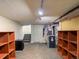 Spacious basement with painted ceiling, wooden shelving, and access to the stairs at 6795 W 29Th Ave, Wheat Ridge, CO 80214