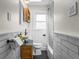 Well-lit bathroom with subway tile, a modern sink, and sleek fixtures, offering a clean and functional space at 6795 W 29Th Ave, Wheat Ridge, CO 80214