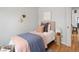 Cozy bedroom with hardwood floors, stylish decor, and soft lighting, creating a warm and inviting atmosphere at 6795 W 29Th Ave, Wheat Ridge, CO 80214