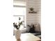 Bright breakfast nook features shiplap walls, window seat with pillows and modern decor at 6795 W 29Th Ave, Wheat Ridge, CO 80214