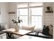 Cozy dining area featuring a built-in bench, large windows, and stylish decor, perfect for enjoying meals and gatherings at 6795 W 29Th Ave, Wheat Ridge, CO 80214