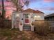 Charming home featuring a red front door, gray exterior, and a cozy, inviting entrance with manicured landscaping at 6795 W 29Th Ave, Wheat Ridge, CO 80214