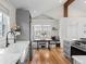Open kitchen with stainless steel appliances, subway tile backsplash, and bright breakfast nook at 6795 W 29Th Ave, Wheat Ridge, CO 80214
