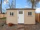 Exterior view of the backyard shed with double doors and surrounding gravel at 6795 W 29Th Ave, Wheat Ridge, CO 80214