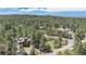 Aerial view of the house surrounded by trees at 533 Tenderfoot Dr, Larkspur, CO 80118