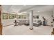 Spacious finished basement featuring comfortable seating, natural light and stylish decor creating a cozy atmosphere at 533 Tenderfoot Dr, Larkspur, CO 80118
