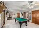Basement game room with a pool table, and mounted deer heads for a rustic, lodge-like aesthetic at 533 Tenderfoot Dr, Larkspur, CO 80118