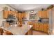 Gourmet kitchen featuring granite counters, custom cabinets, and stainless steel appliances at 533 Tenderfoot Dr, Larkspur, CO 80118