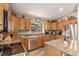 Gourmet kitchen with granite countertops, stainless steel appliances, and custom cabinets at 533 Tenderfoot Dr, Larkspur, CO 80118
