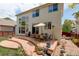 Back of house features a wooden deck with patio furniture, perfect for entertaining outdoors at 5757 W Alamo Dr, Littleton, CO 80123