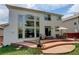 Back of house features a wooden deck with patio furniture, perfect for outdoor enjoyment at 5757 W Alamo Dr, Littleton, CO 80123