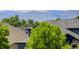 Scenic view of houses with lush foliage and mountain backdrop at 5757 W Alamo Dr, Littleton, CO 80123