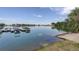 Picturesque lake view with boat docks and clear sky reflecting on the water at 5757 W Alamo Dr, Littleton, CO 80123