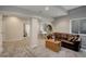 Inviting living room with plush carpeting, stylish furniture, and neutral wall color at 5757 W Alamo Dr, Littleton, CO 80123