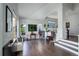 Inviting living room with hardwood floors, large windows, and stylish decor at 5757 W Alamo Dr, Littleton, CO 80123