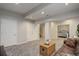 Inviting living room with plush carpeting, stylish furniture, and neutral wall color at 5757 W Alamo Dr, Littleton, CO 80123