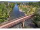 An aerial view of a walking bridge over a river at 2253 S Fox St, Denver, CO 80223