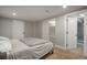 Finished basement bedroom with carpet and two doors that lead into the bathroom and closet at 2253 S Fox St, Denver, CO 80223