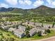 Aerial view of townhome community with mountain views at 114 Vale St, Palmer Lake, CO 80133