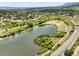 Aerial view showcasing a serene lake and residential area at 114 Vale St, Palmer Lake, CO 80133