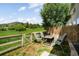 Scenic backyard featuring an outdoor dining set and lush greenery at 114 Vale St, Palmer Lake, CO 80133