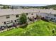 Townhome backyard featuring a wooden fence and lush green lawn at 114 Vale St, Palmer Lake, CO 80133