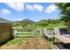 Tranquil backyard with a fence and an outdoor dining set with mountain views at 114 Vale St, Palmer Lake, CO 80133