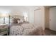 Comfortable bedroom featuring a cozy bed, side tables, and a bright window at 114 Vale St, Palmer Lake, CO 80133
