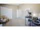 Neutral bedroom with closet, office space, and artistic elephant wall decor at 114 Vale St, Palmer Lake, CO 80133