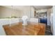 Dining area with wood table and seating, complemented by stylish decor and a view to the kitchen at 114 Vale St, Palmer Lake, CO 80133
