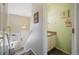 Inviting entryway with decorative lighting, stylish accents, and a convenient half-bath at 114 Vale St, Palmer Lake, CO 80133