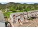 View of multiple townhomes with a beautiful mountain range in the background at 114 Vale St, Palmer Lake, CO 80133
