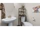 Stylish powder room with a modern vessel sink and an artistic touch at 132 Ambrose St, Erie, CO 80516